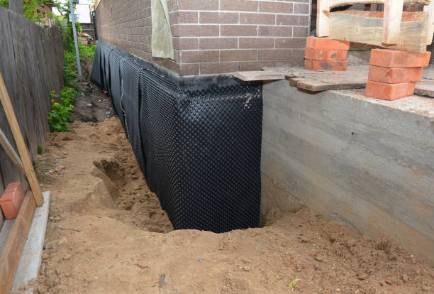 SJ Waterproofing Pros technician performing targeted Waterproofing assessment in Theresa, WI